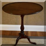 F18. Mahogany pedestal side table with rotating tilt top. 30”h x 26”w - $275 